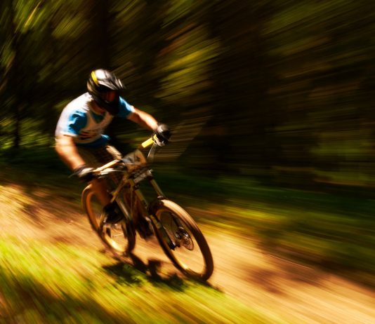 shot of a cyclist riding extremely fast