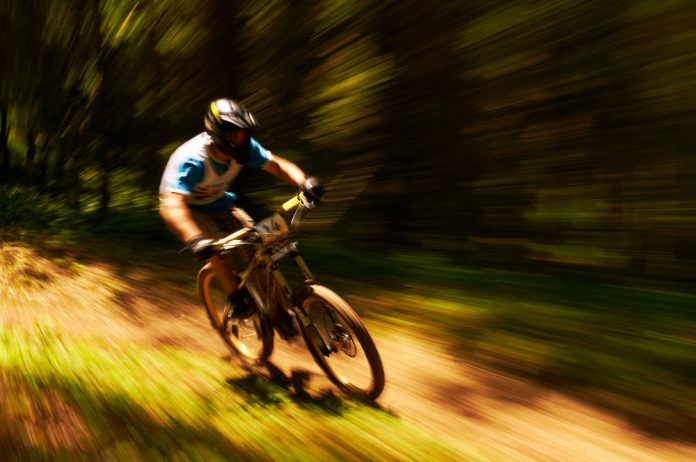 shot of a cyclist riding extremely fast