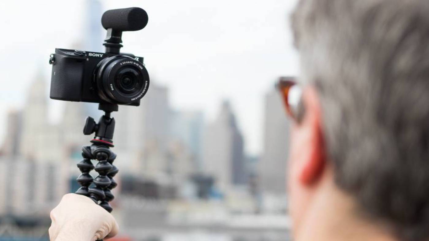 Man vlogging with camera on tripod